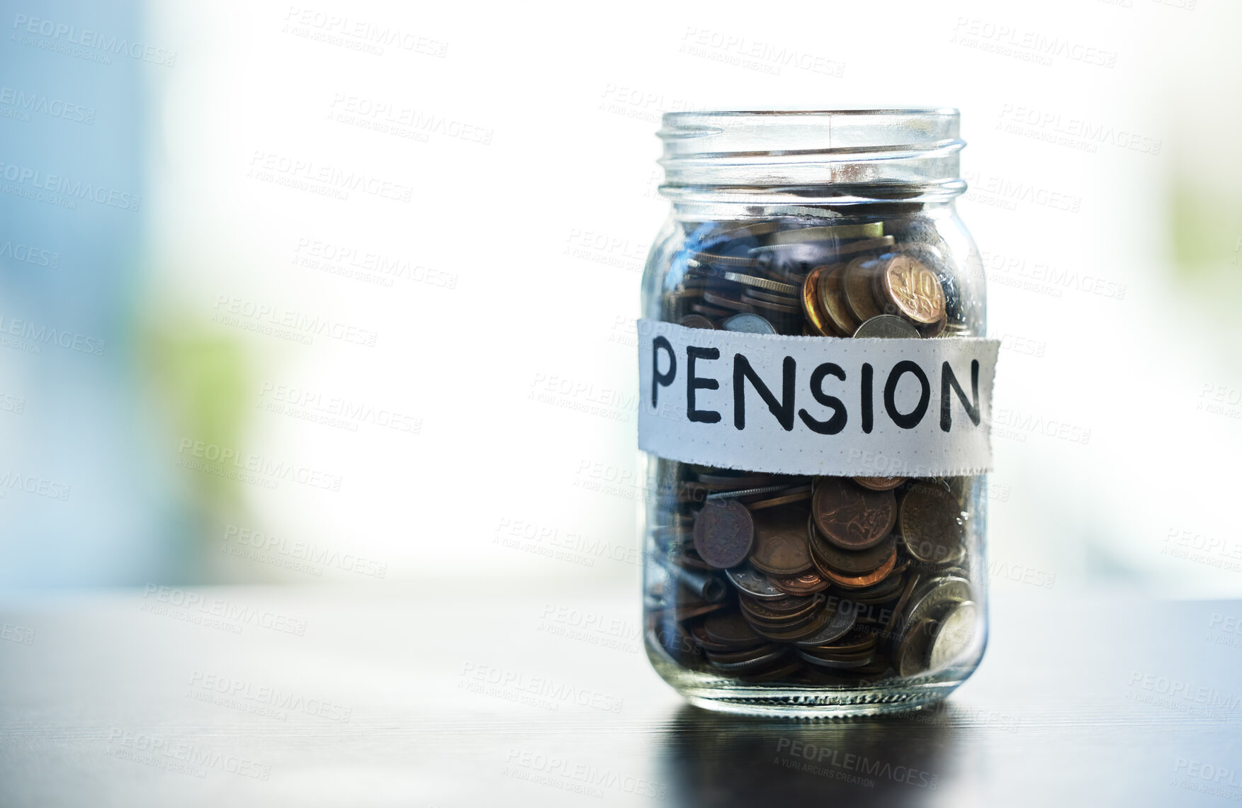 Buy stock photo Shot of a pension money jar on a table at home