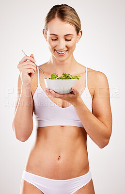 Buy stock photo Woman, underwear and salad for diet in studio, healthy nutrition and vegan detox on white background. Female person, eating vegetables and lingerie for organic food for vitamins, meal and minerals