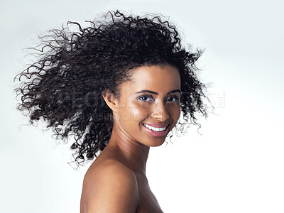 Buy stock photo Studio portrait of a gorgeous young woman smiling while standing topless against a grey background