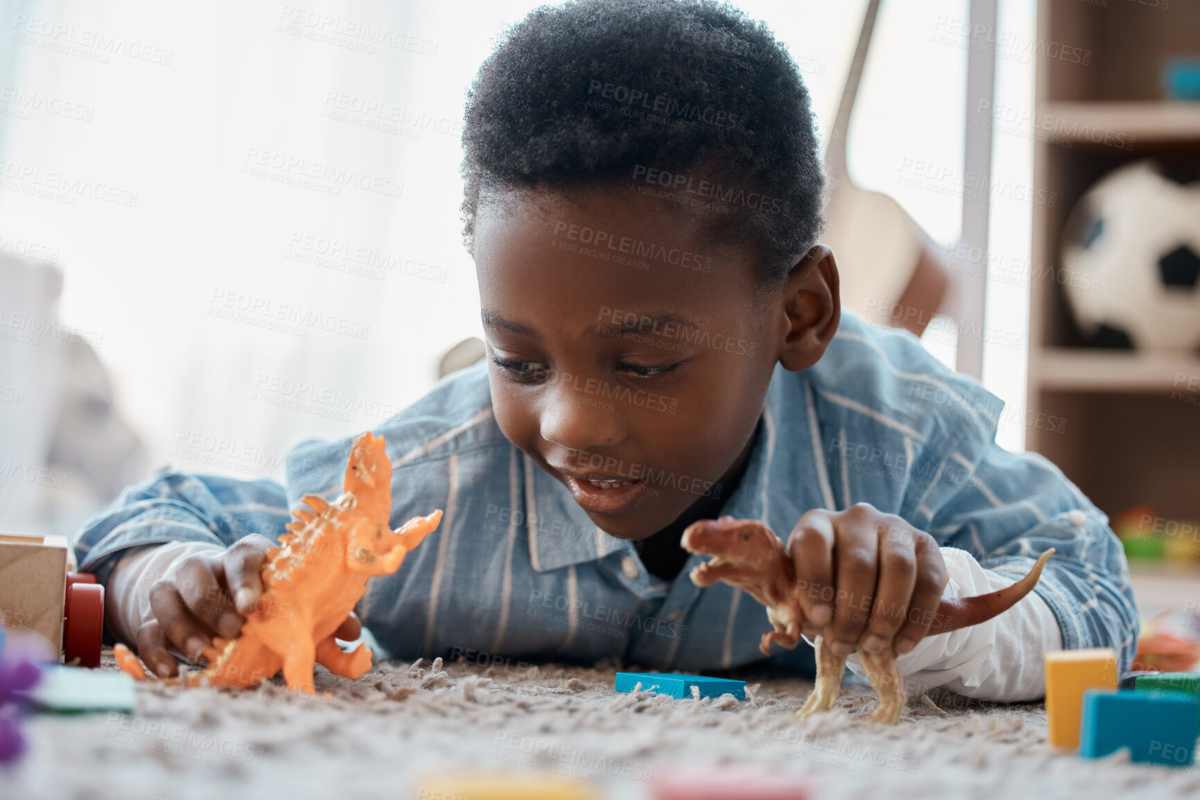 Buy stock photo Boy, home and happy on playing with toy on floor for fun, relax and break for child development. Bedroom, kid and smile with plastic dinosaur for fantasy, games and chill for childhood memories