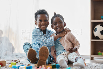 Buy stock photo Shot of an adorable little girl and boy playing together