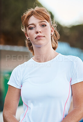 Buy stock photo Shot of an attractive young woman standing alone outside after playing hockey