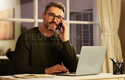 Buy stock photo Cropped portrait of a handsome mature businessman making a phonecall while working on his laptop at home