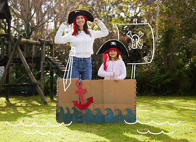 Buy stock photo Shot of a mother and daughter dressed up like pirates outside in the yard
