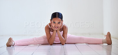 Buy stock photo Portrait of a little girl doing the splits in a ballet studio
