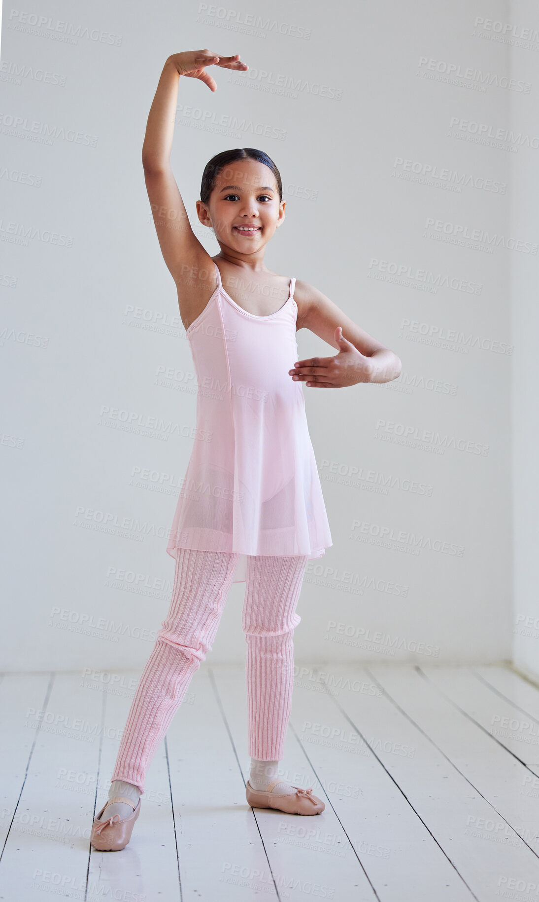 Buy stock photo Portrait of a little girl practicing ballet in a dance studio