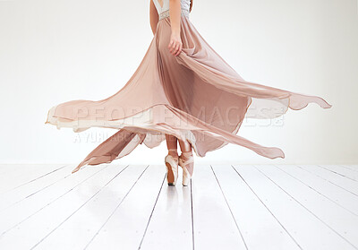Buy stock photo Full length shot of an unrecognizable young female ballerina practicing in her dance studio