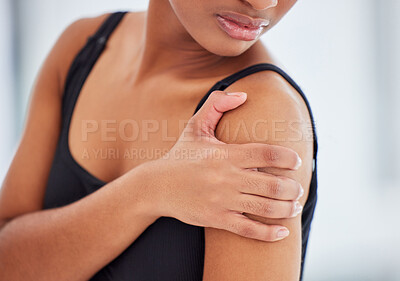 Buy stock photo Shot of a young ballerina suffering from shoulder pain