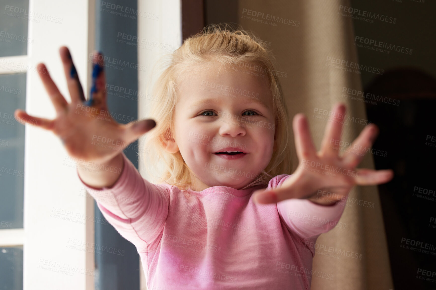 Buy stock photo Shot of an adorable little girl showing off her hands with paint on it