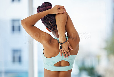 Buy stock photo Stretching, arm and back of woman for exercise, fitness and injury prevention before physical activity. Indoor, female person and warm up with balance for wellness, health and optimal performance