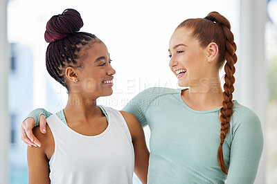 Buy stock photo Shot of two young women standing close together after practising yoga