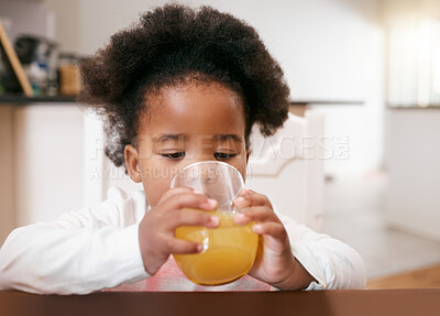Buy stock photo Shot of a little girl drinking a glass of juice