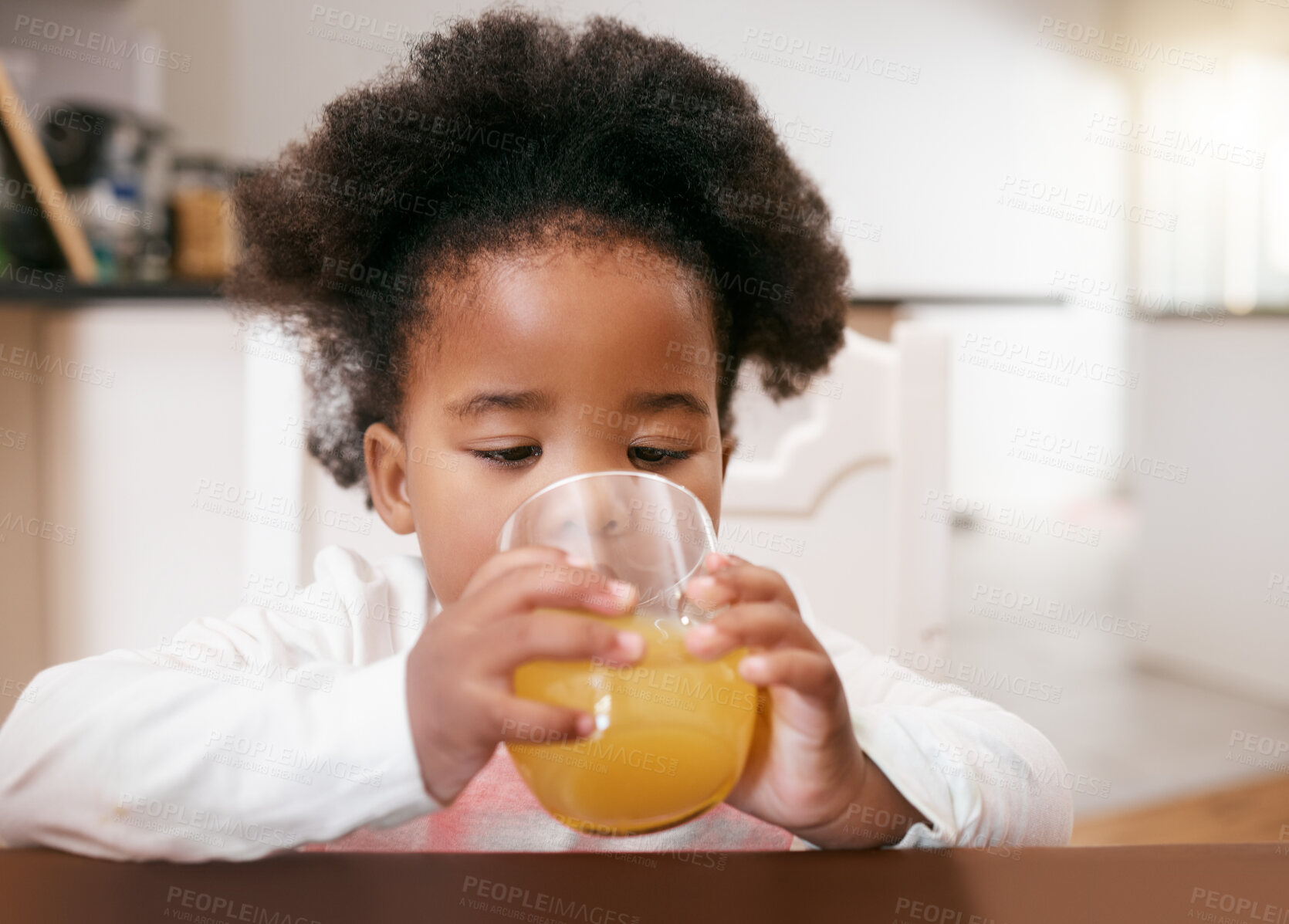 Buy stock photo Black girl, kid and drinking juice for health in home, vitamin c and beverage for growth development. Female person, diet and nutrition for wellness, citrus and child for organic freshness or thirsty