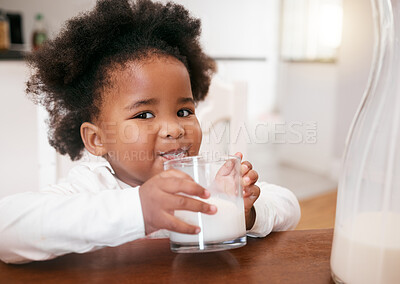 Buy stock photo Shot of a little girl enjoying a glass of milk