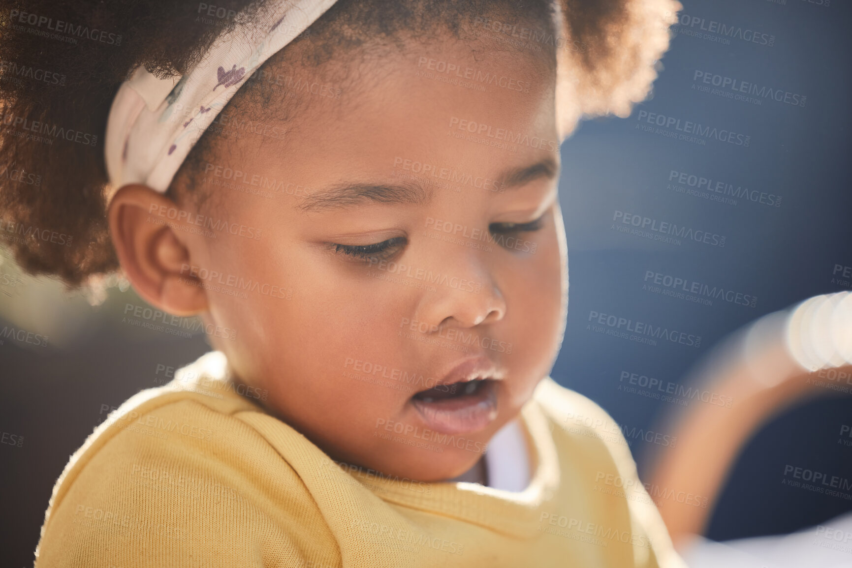 Buy stock photo Shot of a little girl playing in a garden