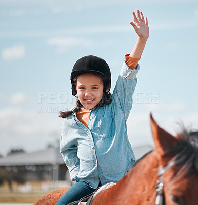 Buy stock photo Shot of an adorable little girl riding a horse