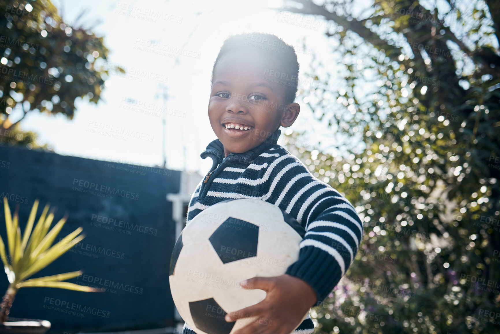 Buy stock photo Shot of an adorable little boy playing outside with his ball