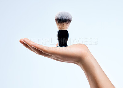 Buy stock photo Shot of an unrecognizable man holding a brush against a white background