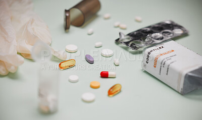 Buy stock photo Shot of medical pills against a green background