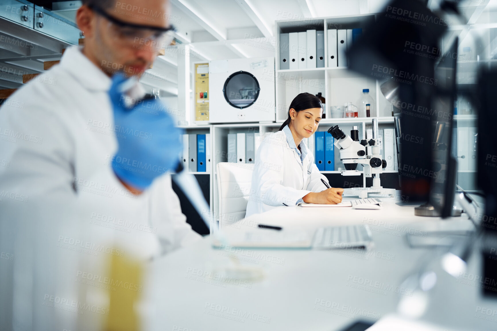 Buy stock photo Scientist, woman and writing notes for research, test and chemical analysis for health innovation in lab on microscope. Dropper, science and medical study of drugs, liquid and exam for biotechnology