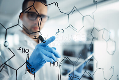 Buy stock photo Shot of a young scientist solving equations on a glass screen in a laboratory