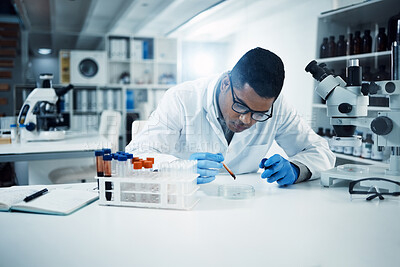 Buy stock photo Science, analysis and male scientist in a laboratory doing research with blood samples or tests. Dna, medical innovation and professional man researcher working on a rna project in pharmaceutical lab