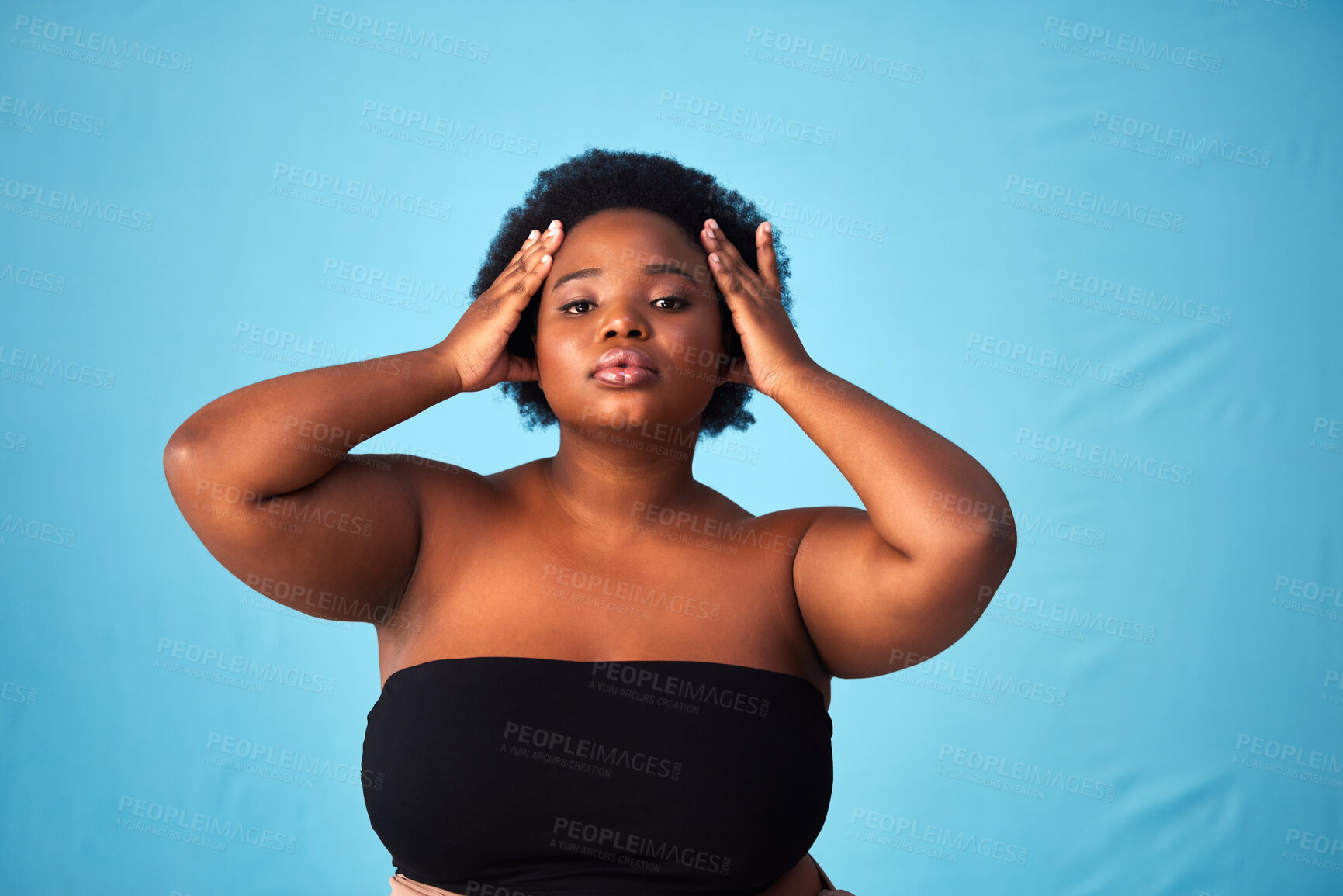 Buy stock photo Black woman, studio and hair care with natural or portrait for aesthetics, afro with moisture for wellness. Person, blue background or glow with hairstyle for cosmetic, plus size with confidence