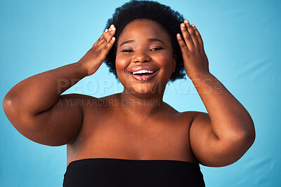 Buy stock photo Black woman, studio or makeup in portrait or hands for beauty, skin and moisture for wellness. Female person, blue background or haircare with afro with natural shine, plus size with confidence