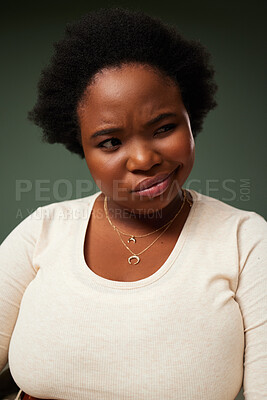 Buy stock photo Black woman, thinking and confused in studio with attitude, fashion and confidence on green background. Female person, decision and afro with doubt for decision, choice and idea with emoji expression