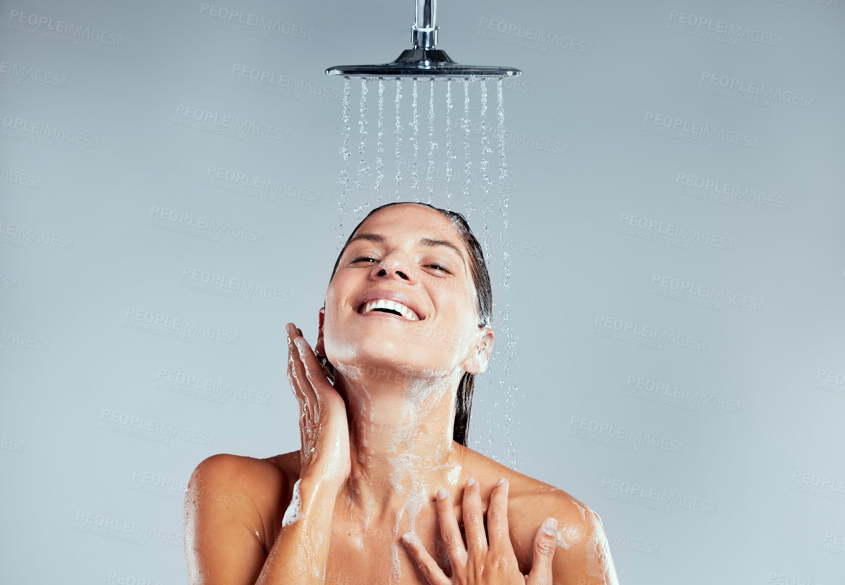 Buy stock photo Studio, shower or happy woman washing for skincare, body hygiene or cleaning with smile or water. Relax, grey background or girl with wellness or liquid for beauty or grooming for morning routine