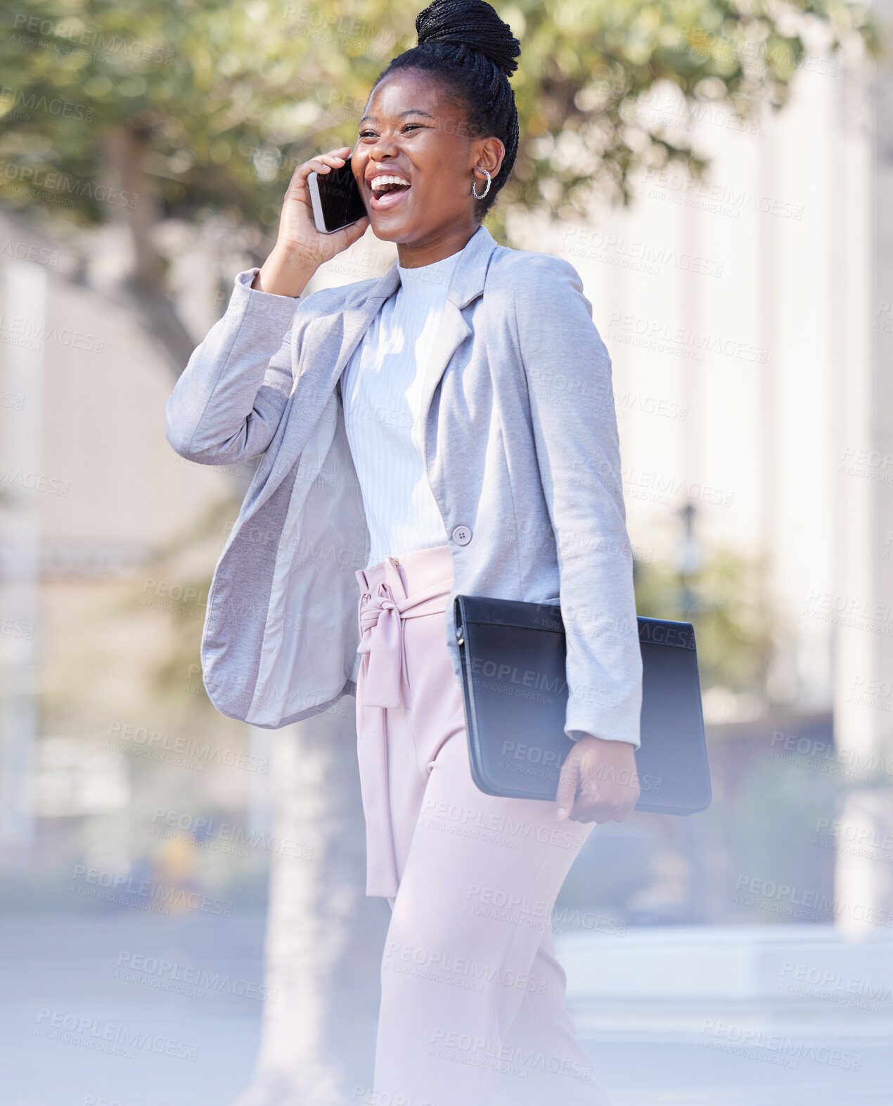 Buy stock photo Shot of a young businesswoman making a phone call using her smartphone