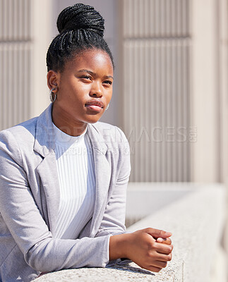 Buy stock photo Shot of a young businesswoman taking a break to daydream