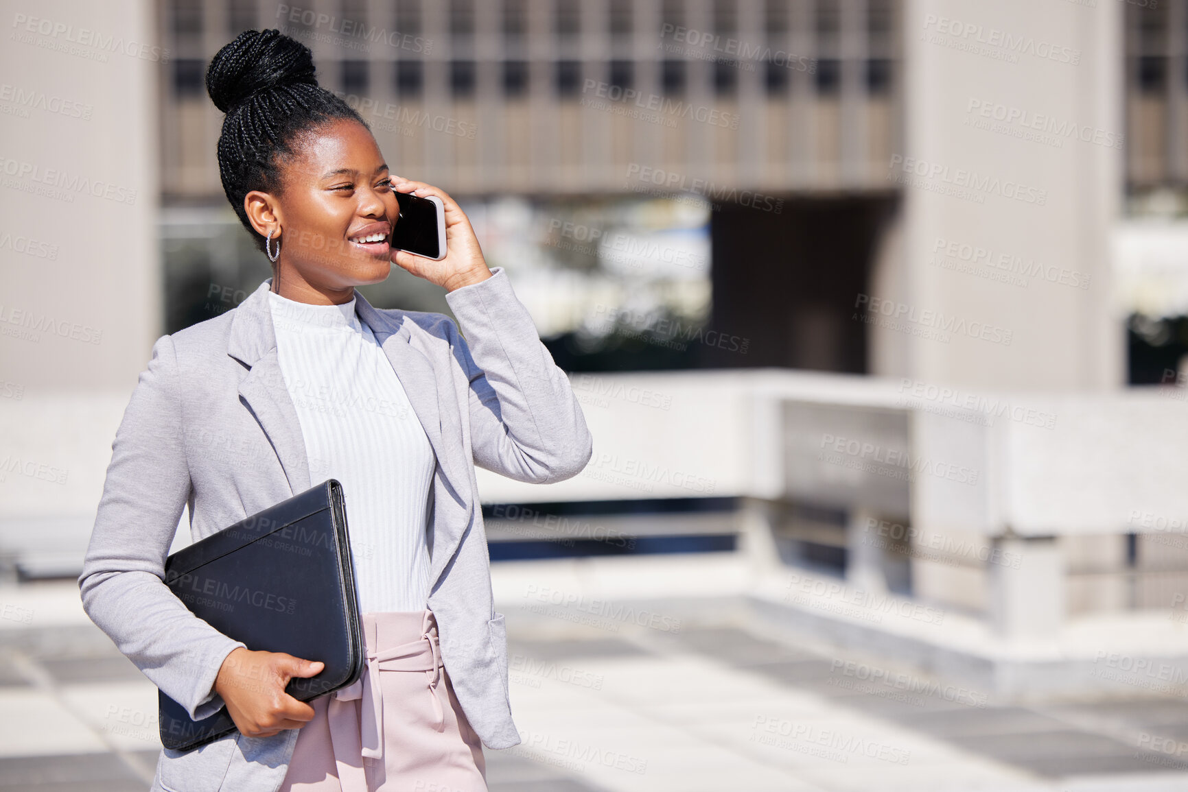 Buy stock photo Shot of a young businesswoman making a phone call using her smartphone