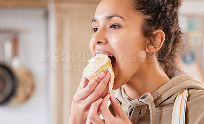 Buy stock photo Eating, cupcake and woman in home for dessert, sweet treat or sugar snack in kitchen. Bite, tasting and female person with vanilla cake for cheat meal, hungry and enjoy delicious food in apartment