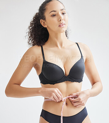 Buy stock photo Woman, lingerie and confidence for weight loss, diet and pressure with measuring tape on waist. Female person, self esteem and wellness for mental health, care and goal for body positivity or beauty 