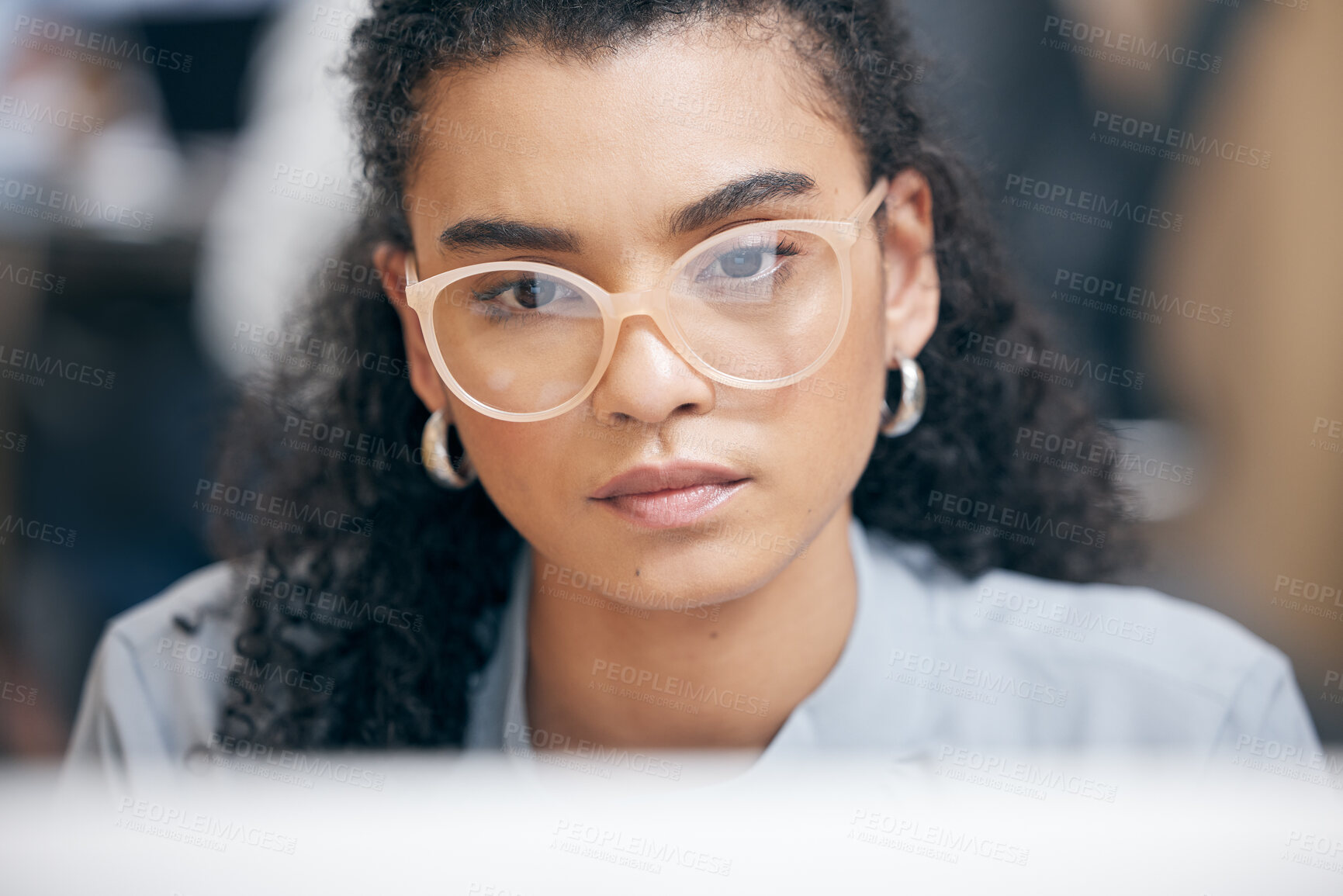 Buy stock photo Face, serious and business woman on computer reading email, research or network online in startup office. Thinking, glasses and professional consultant work on project, report or planning on internet