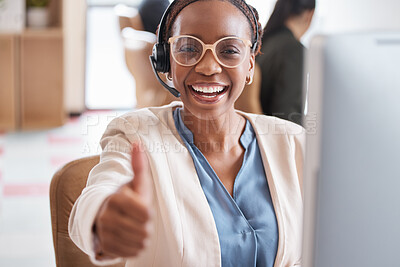 Buy stock photo Cropped portrait of an attractive young female call center agent giving thumbs up while working at her desk in the office