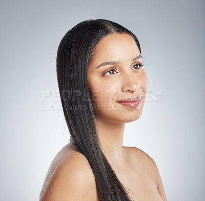 Buy stock photo Shot of an attractive young woman standing alone and posing in the studio