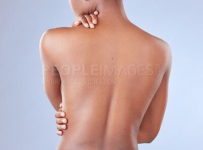 Buy stock photo Rearview shot of an unrecognisable woman posing topless