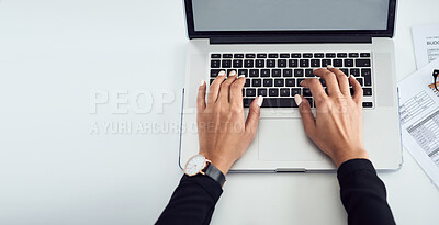 Buy stock photo High angle shot shot of an unrecognisable businesswoman typing on a laptop keyboard in an office
