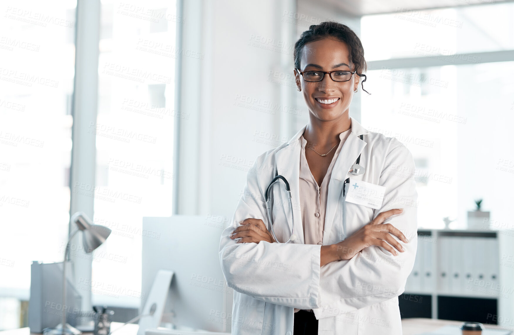 Buy stock photo Doctor, happy and confidence in hospital for healthcare, medical services and cardiology surgeon. African woman, portrait and crossed arms in clinic for wellness, health and experience in medicine