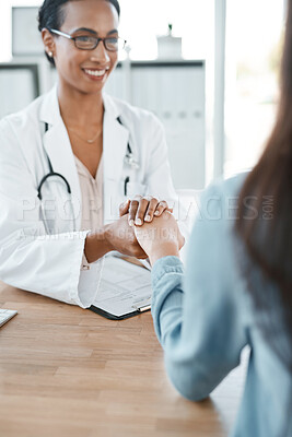 Buy stock photo Shot of a young doctor comforting her patient