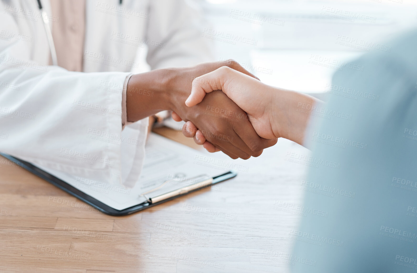 Buy stock photo Patient, doctor and meeting with handshake for medical aid agreement or hospital appointment. Closeup of person shaking hands with healthcare employee on health form, insurance or thank you at clinic