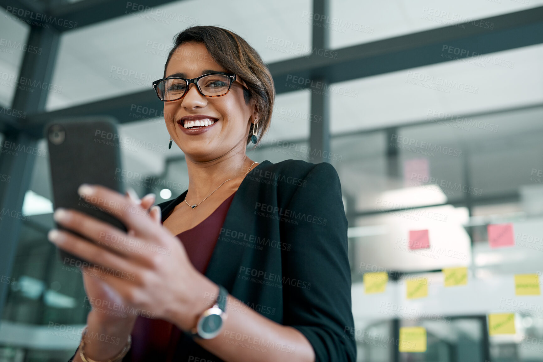Buy stock photo Smartphone, smile and professional businesswoman in the office typing an email or networking on internet. Communication, technology and designer doing creative research on phone with sticky notes