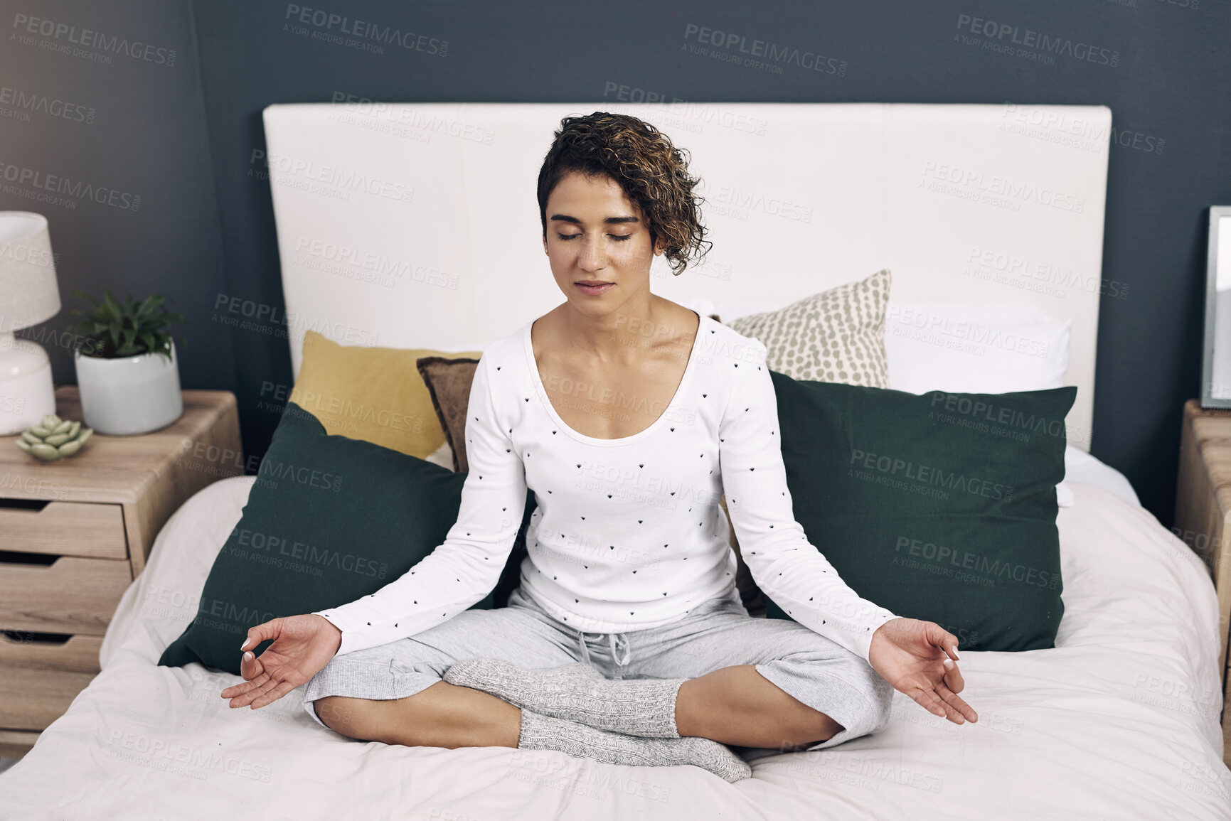 Buy stock photo Woman, relax and meditation on bed in home for mindfulness, peace and mental health on weekend. Zen, house and person with chakra healing for holistic balance, connection and awareness in wisdom