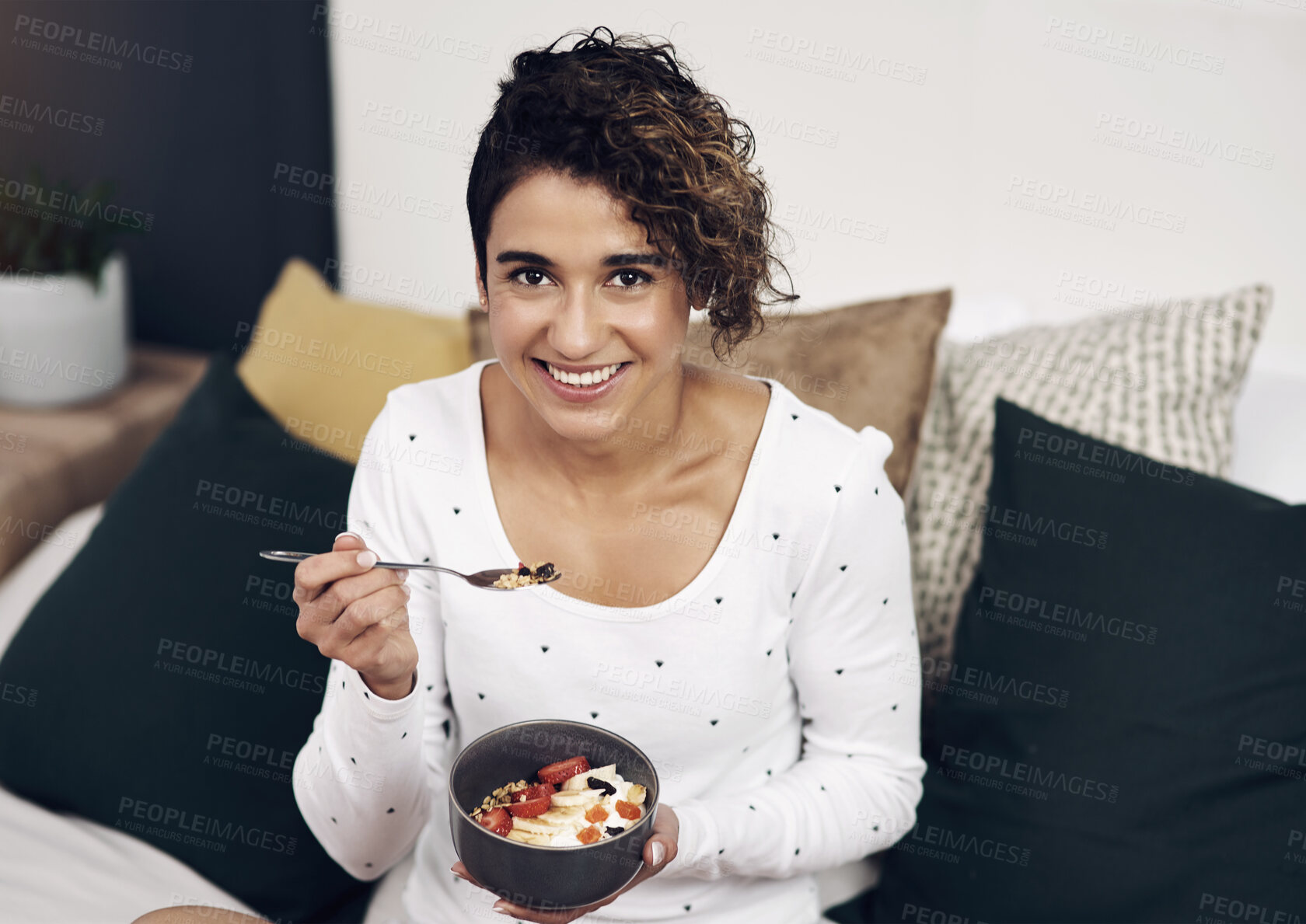 Buy stock photo Home, portrait and woman with breakfast, bowl and smile with nutrition, organic food and happiness. Face, bedroom or person with healthy meal, relax or girl with break, wellness or eating fruit salad