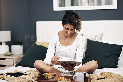 Buy stock photo Bedroom, home and woman with tablet, breakfast and smile with social media, digital app and morning. Apartment, message or girl with tech, nutrition and connection with network, typing or online news