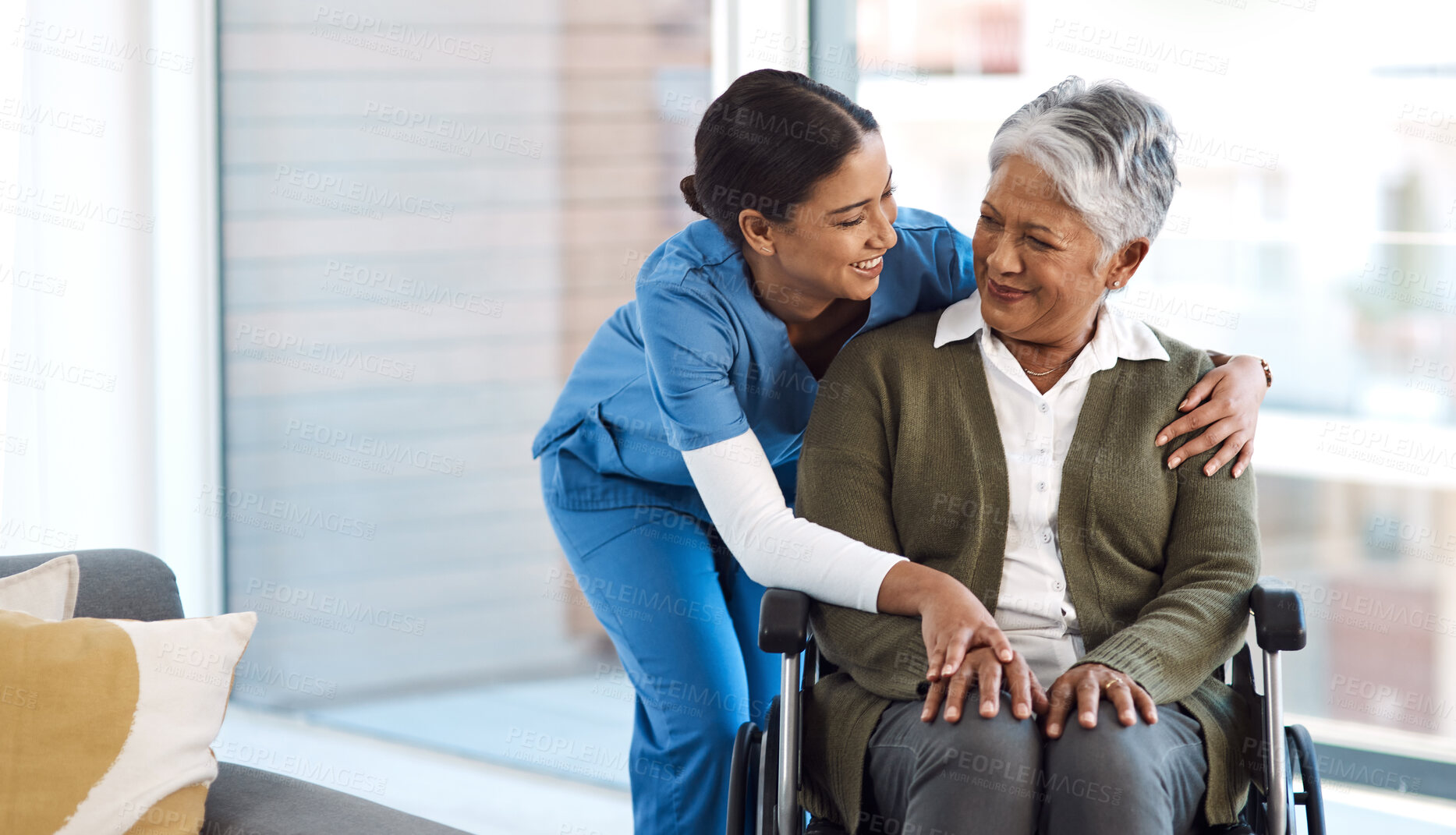 Buy stock photo Hug, nurse with senior woman in wheelchair and talking for support. Happy, smile and communication with female nurse holding disabled senior patients hand for caregiver in nursing home consulting