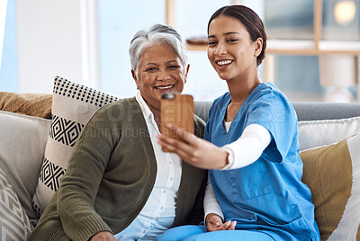 Buy stock photo Caregiver, selfie or old woman in nursing home with smile or happiness for profile pictures or retirement. Women, photography or happy nurse relaxing or smiling with elderly patient for wellness 