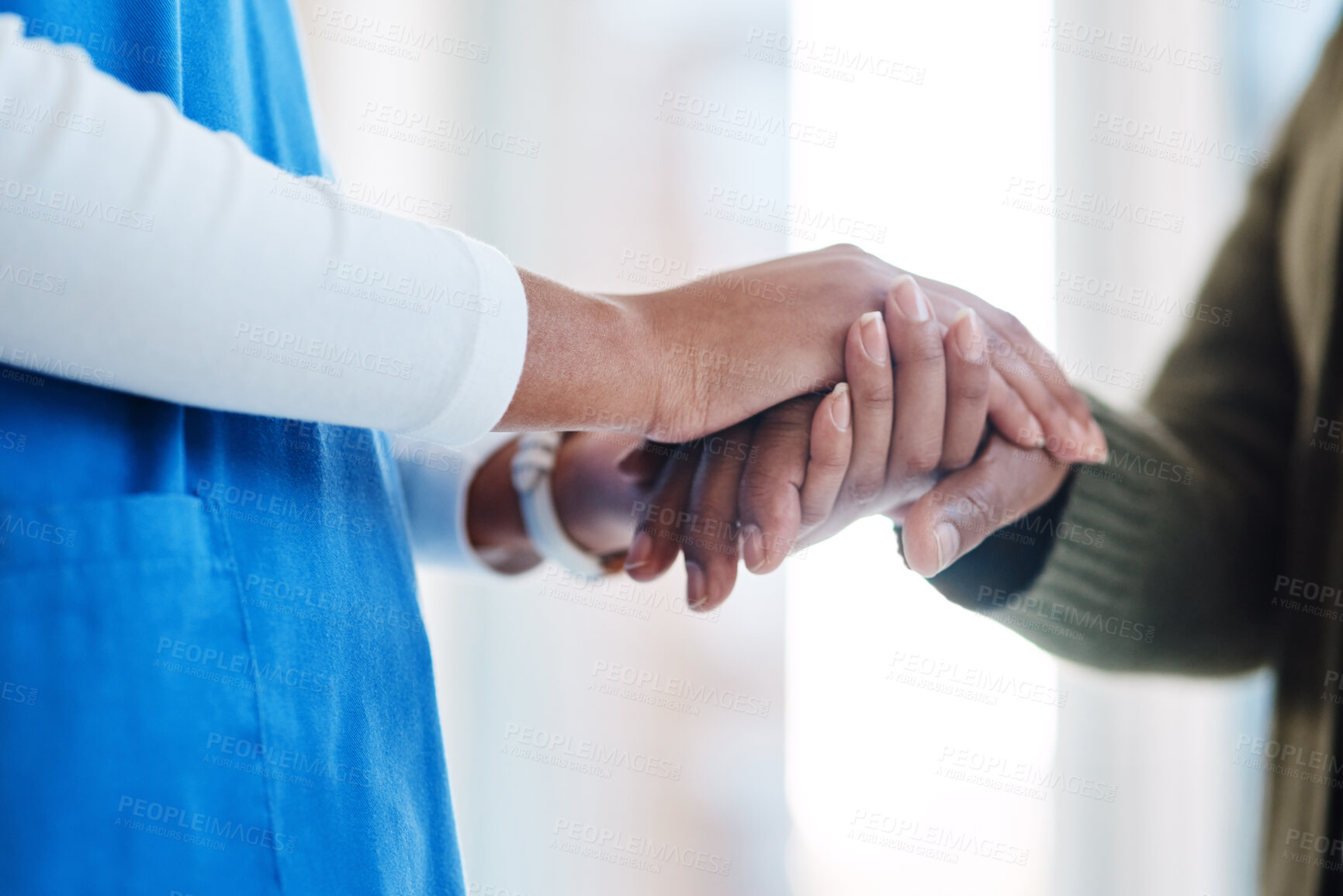Buy stock photo Woman, holding hands or consulting a nurse for support or empathy for healthcare service of cancer therapy. Closeup, psychology clinic or sick patient in counseling with a caregiver in consultation 